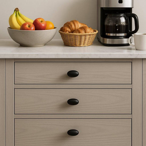 Oval Matte Black Cabinet Knobs 10 Pack For Kitchen And Furniture By EAXINTA installed on wooden drawers with kitchen items