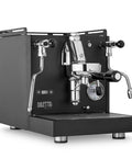 Rock Solid Dual Boiler Espresso Machine Bundle With Precision Grinder And Pid Temp Control To Craft Smooth Barista Drinks Without Any Stress. Close-up of sleek black espresso machine with chrome accents.