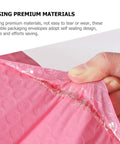 Close-up of self-sealing edge on pink bubble mailer envelopes 11x15 plus 4 inch padding, showing tear-resistant material