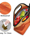 Sunset Insulated Lunch Tote Bag Portable Lunch Box with apples and bottle visible, showcasing waterproof and easy-to-clean features.