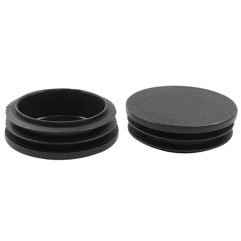Paquete de 4 tapones Inch de plástico Inch 5 Inch con extremos negros para tubos redondos, en el que se muestran dos tapones de plástico negros, uno al lado del otro.