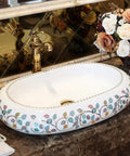 Damn Fine Hand Painted Oval Countertop Washbasin With A Truly Knockout Leaf Pattern Heavy Duty Ceramic Bathroom Sink on marble countertop.