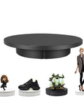 Heavy Duty Motorized Rotating Turntable With Remote Control 360 Degree Electric Product Display Stand For Jewelry Photography Video Marketing Show And Retail Store Black 24 Inch Wide Base with various products showcased.