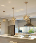 Moravian Star Brass Pendant Light, Dope Modern 14 Inch Ceiling Fixture With Clear Glass Shade above kitchen island