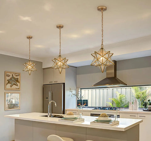 Moravian Star Brass Pendant Light, Dope Modern 14 Inch Ceiling Fixture With Clear Glass Shade above kitchen island
