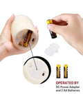 Inserting batteries into Flameless Pillar Candles Set Of 12 With Remote Control Battery Operated Real Wax Led Candles