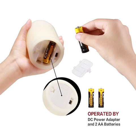 Inserting batteries into Flameless Pillar Candles Set Of 12 With Remote Control Battery Operated Real Wax Led Candles