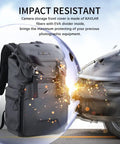 Large Capacity Camera Backpack With Tripod Storage being impact resistant against a car, features dual compartments and removable divider