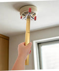 Ladder Free Smoke Sensor Removal Tool With 11 Point Eight Inch Extended Reach Stick reaching high ceiling smoke detector.