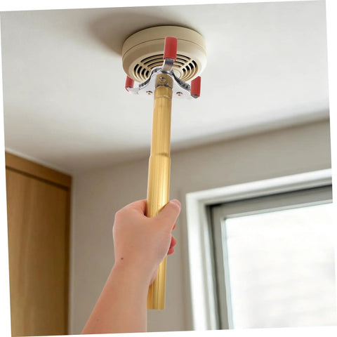 Ladder Free Smoke Sensor Removal Tool With 11 Point Eight Inch Extended Reach Stick reaching high ceiling smoke detector.