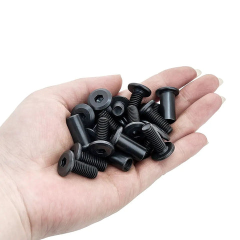 Twenty Five Piece M8x20mm Black Furniture Bolts Cabinet Connector Screws Barrel Nuts Carbon Steel Hardware Kit held in a hand.
