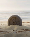 Beefy Tank Wheel With Bearing For Carts And Equipment Transport 5 Inch Universal Fit Rubber Wheel on a sandy beach.