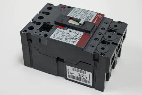 Tough As Nails Three Pole Circuit Breaker Rated 100 Amps At 600 Volt AC Featuring Electronic Solid State Trip Technology side view