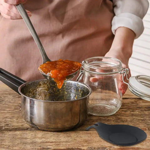 Using Three Piece Silicone Spoon Rest Set in kitchen with stainless pot and glass jar, Black utensil holder shown