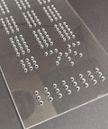 Built Tough Acrylic Cribbage Template And 1/4 Inch Thick Router Guide Kit For Building Slick Game Boards With Crisp Drill Marks And Tight Three Track Routing Project, showing precise hole spacing in clear acrylic.