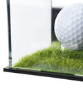 Golf ball displayed in a UV Protected Acrylic Display Case For Autographed Golf Balls And Memorabilia With Adjustable LED Lighting on grass