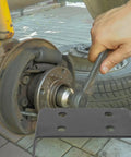 Close-up of hand using wrench on axle with Beefy Trailer Hitch Winch Mounting Plates 2 Pack For Off Road ATV And Truck inset