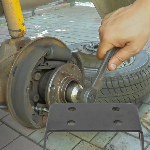 Close-up of hand using wrench on axle with Beefy Trailer Hitch Winch Mounting Plates 2 Pack For Off Road ATV And Truck inset