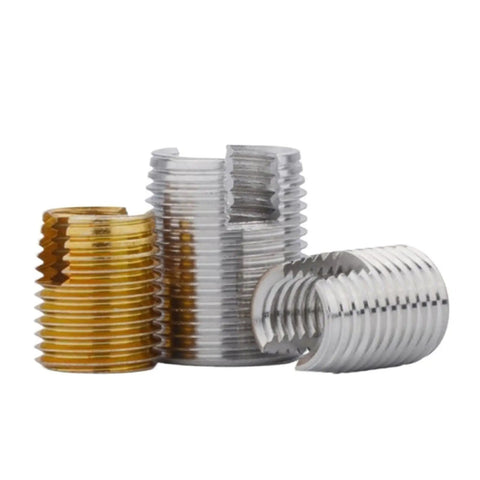 Three self tapping thread inserts in silver and gold for M2 to M16 repair, ideal for fixing damaged threads in cars and gear.