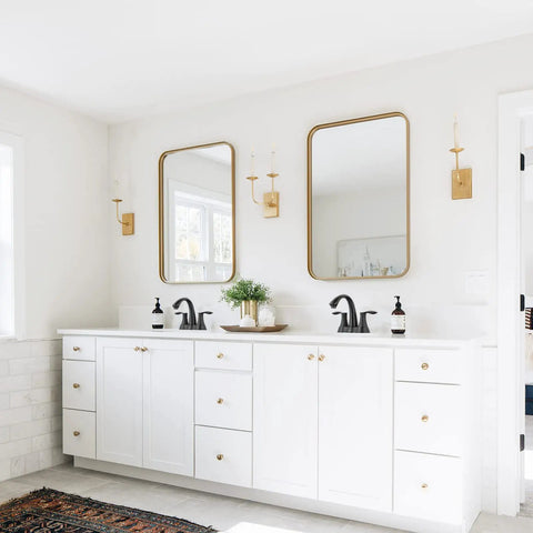 Matte Black 4 Inch Centerset Bathroom Faucet With Two Handles Pop Up Drain And Supply Lines Solid Brass Construction No Fuss Install Spot Resistant Finish ADA NSF cUPC Certified installed on white double vanity in bright bathroom