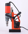Powerful 1280W Portable Magnetic Drill Press With Super Strong Electromagnet For Heavy Duty Metal Drilling Tasks Up To 1 Point 38 Inch Core Diameter And 660 RPM Speed For Industrial Job Sites, side view of orange and gray drill.