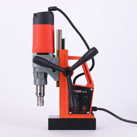 Powerful 1280W Portable Magnetic Drill Press With Super Strong Electromagnet For Heavy Duty Metal Drilling Tasks Up To 1 Point 38 Inch Core Diameter And 660 RPM Speed For Industrial Job Sites, side view of orange and gray drill.