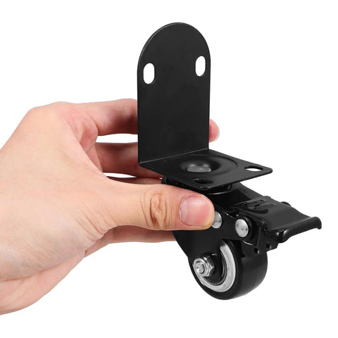 Handheld heavy duty 2 inch swivel furniture caster wheel with plastic plate, ideal for drawers and office desks.