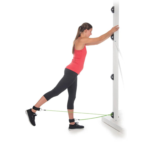 Woman performing a stretch with the Stellar Resistance Band Wall Anchor Kit For Home Gym And Physical Therapy Badass Steel Loop Hook.