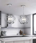 Globe Four Light Crystal Chandelier With Industrial Sphere Cage Chrome Finish Adjustable Hanging Pendant Lighting in kitchen view