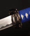 Close-up of the blue hilt and silver blade of Three Piece Iaido Katana Set With Display Stand, Badass Blue Blade And Engraved Scabbard Pattern