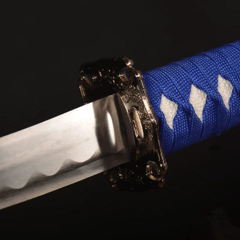 Close-up of the blue hilt and silver blade of Three Piece Iaido Katana Set With Display Stand, Badass Blue Blade And Engraved Scabbard Pattern