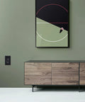 Black GFCI Outlet 15 Amp 2 Pack With LED Indicator Weather Resistant installed on green wall near wooden cabinet