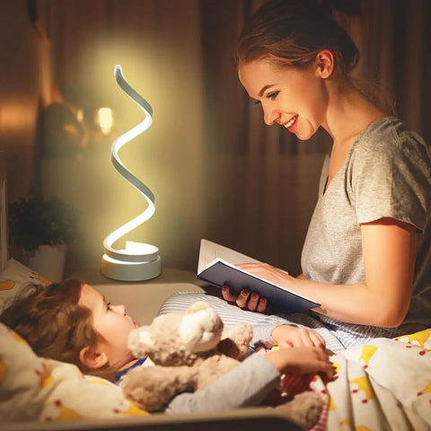 Woman reading to child at night with Spiral LED Desk Lamps Set Of 2 10W Modern Bedside Lights softly illuminating the room.