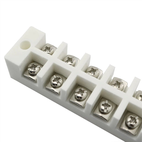 Six-position white porcelain terminal block with screw terminals; angled view