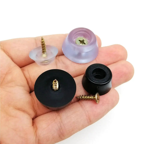 Hand holding clear and black adjustable leveling feet set of 48 for furniture tables chairs and cabinets wobble free shockproof glide feet