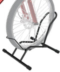 Freestanding Bike Floor Stand For Indoor And Outdoor Use, Adjustable 16 To 29 Inch Wheel Width, holding a bike wheel