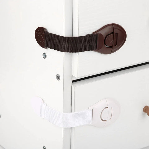 Baby Safety Locks For Cabinets And Drawers Adhesive Child Proofing Locks With Flexible Belt Connection Durable ABS And Nylon shown on drawers