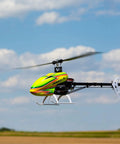 330 S RTF Basic Drone With Safe Technology in flight, showcasing bright colors and sleek design against a blue sky with clouds.