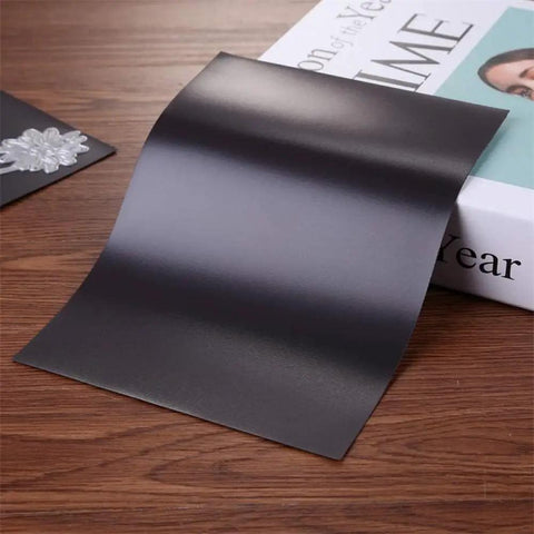 Scrapblooms Portable Electric Die Cut And Embossing Machine Kit For Automatic A4 Crepe Paper Flower Making Card Craft includes black magnetic sheet on wooden table.