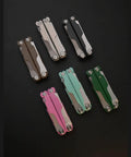 Multiple 20 In 1 EDC Multi Tool Pliers With Spring Loaded Pliers Head Detachable Screwdriver Bits in various colors displayed on black surface