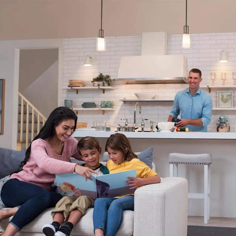 Family enjoying reading together on a sofa with Smooth Flicker Free Led Dimmer Switch With Matching Almond Wallplate Included.