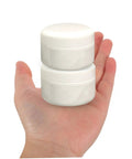 Hand holding two white jars from Two Pack Ceramic Repair Paste Kit For Tiles And Porcelain Restoration Fast Dry Formula To Fix Chips Scratches And Dents At Home DIY Friendly Indoor Tile Repair For Kitchens Bathrooms And Other Surfaces.
