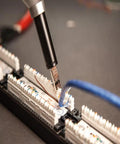 Impact Punchdown Tool Kit For 66 And 110 Panels And Wall Jacks cushion grip in use on telecom panel with wires
