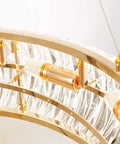 Curved Crystal Ceiling Pendant Light Ring LED Lamp Modern Home Decor Warm Glow Adjustable Wire Fixture showing gold fixtures and glass details.