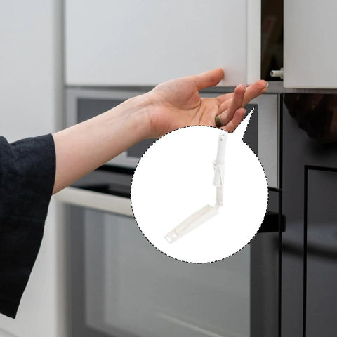 Hand reaching for a cabinet using Upgrade Your Cupboards With These Durable White Plastic Rebounders For Easy Push To Open.