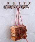 Heavy Duty Stainless Steel Wall Coat Rack With Five Sturdy Hooks For Coats Hats Robes And Towels Sleek Rustproof hanging bricks with red string.