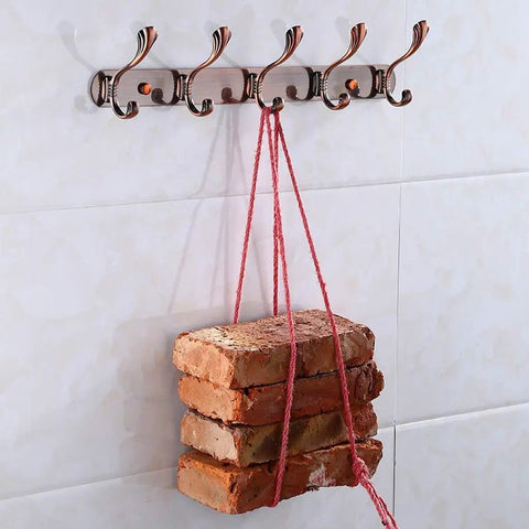 Heavy Duty Stainless Steel Wall Coat Rack With Five Sturdy Hooks For Coats Hats Robes And Towels Sleek Rustproof hanging bricks with red string.