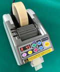 Automatic Tape Dispenser And Heavy Duty Cutting Machine With Bright Led Digital Panel and tape roll in use.