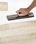 Using No Hammer Needed Tapping Block With Ergonomic Ball Handle for installing laminate, hardwood, and vinyl plank floors.