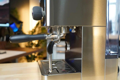 Close-up of Top Tier Dual Boiler Espresso Maker With Smart Thermoblock And Precise PID Temp Control, featuring 58mm portafilter in stainless steel.
